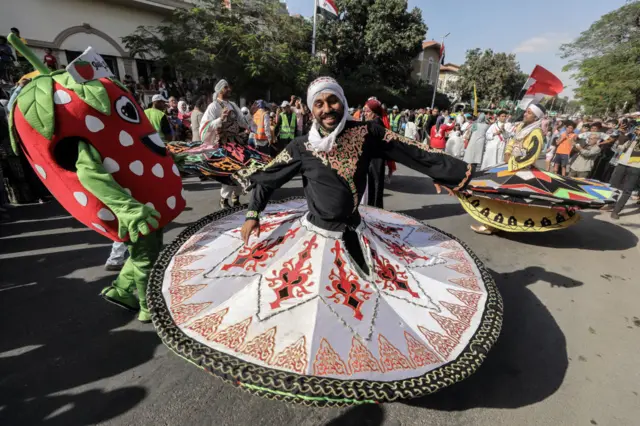 People perform during a celebration ceremony called the Sham el-Nessim festival, which is known as the spring festival and dates back to the ancient Pharaonic period in Ismailia, Egypt on May 13, 2024.