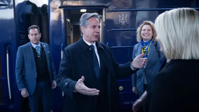 Antony Blinken is greeted by US Ambassador to Ukraine Bridget A. Brink after arriving by train