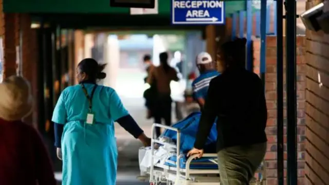 Health workers pushing a trolley at a hospital in South Africa