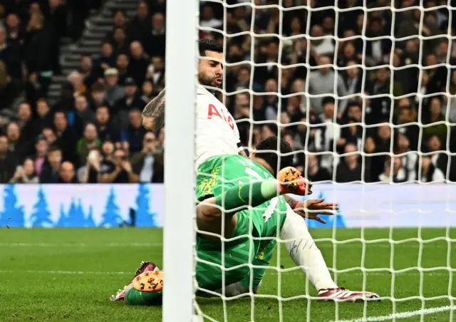 Ederson is clattered by Romero