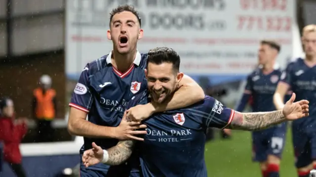 Raith's Dylan Easton (C) celebrates scoring to make it 2-0 with teammate Shaun Byrne (L) during a cinch Championship match between Raith Rovers and Partick Thistle at Stark's Park, on December 08, 2023, in Kirkcaldy, Scotland.