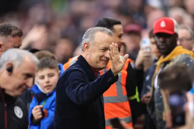 Tom Hanks waves to Villa fans