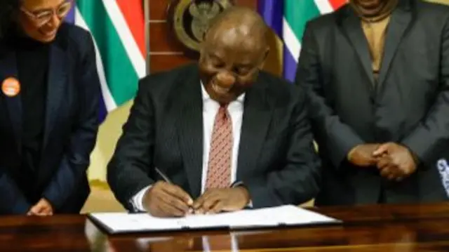 South African President Cyril Ramaphosa signs into law the South African Sign Language Bill which sees the sign language as the 12th official language at the Union Buildings on July 19, 2023 in Pretoria, South Africa.