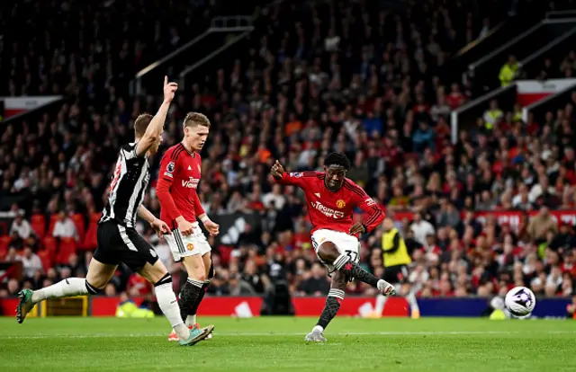 Kobbie Mainoo of Manchester United scores the opening goal