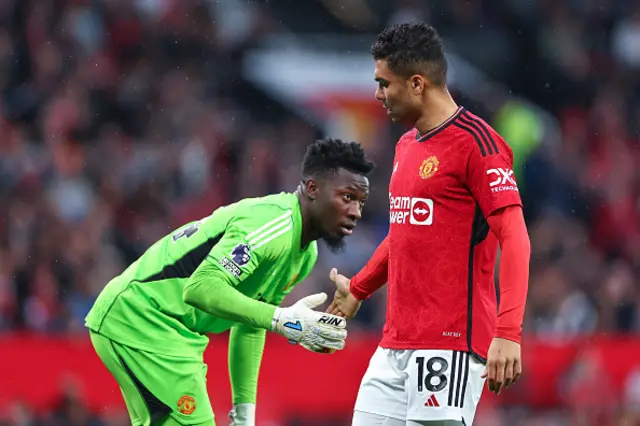 Andre Onana and Casemiro high five each other