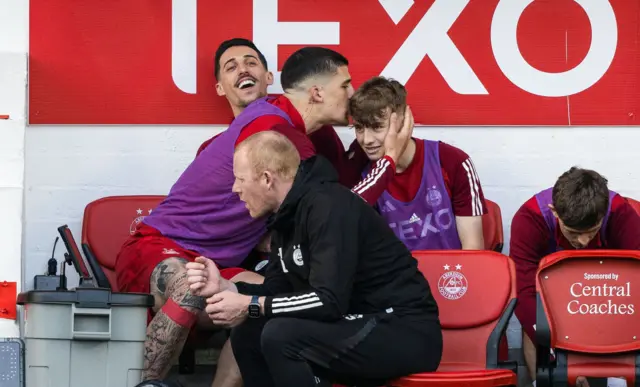 Aberdeen's Slobodan Rubezic, Bojan Miovski and Fletcher Boyd watch from the bench