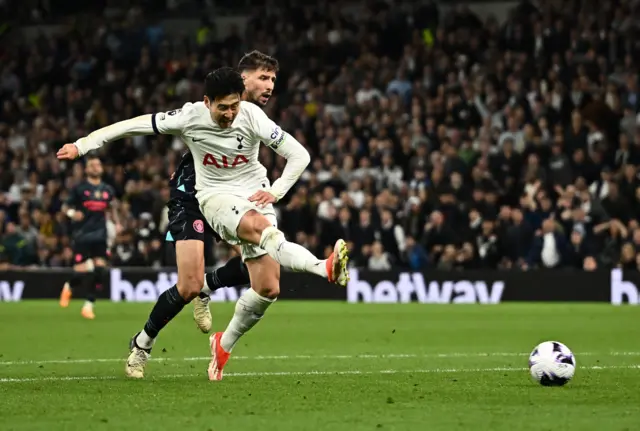 Tottenham's Son Heung-min shoots at goal against Manchester City