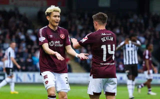 Hearts' Kyosuke Tagawa (L) celebrates scoring to make it 1-1 with teammate Cammy Devlin (R) during a cinch Premiership match between St Mirren and Heart of Midlothian at the SMiSA Stadium,