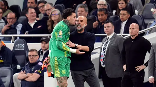 Ederson shows his frustration to Pep Guardiola after being replaced against Tottenham