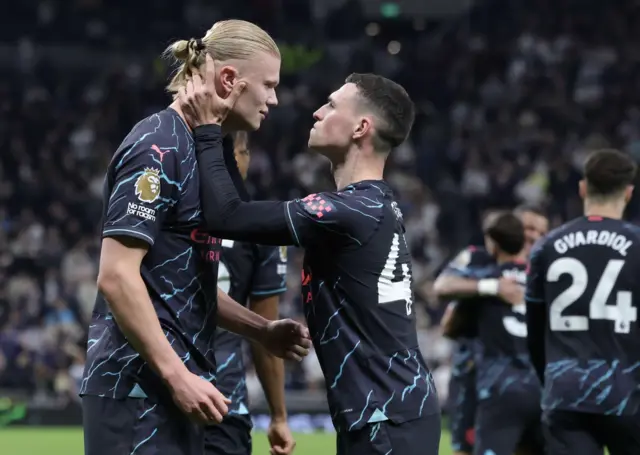 Phil Foden congratulates Erling Haaland after scoring against Tottenham