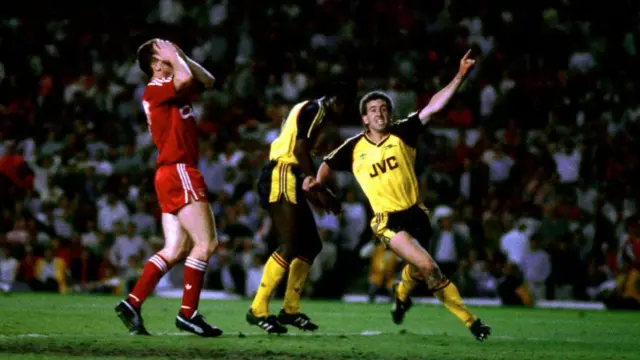 Arsenal players celebrate Michael Thomas' goal against Liverpool in 1989