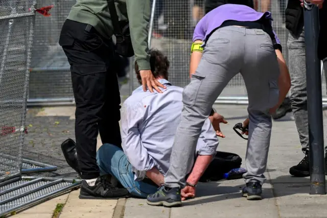 A person is detained after shooting incident of Slovak PM Robert Fico, after a Slovak government meeting in Handlova, Slovakia, May 15, 2024.