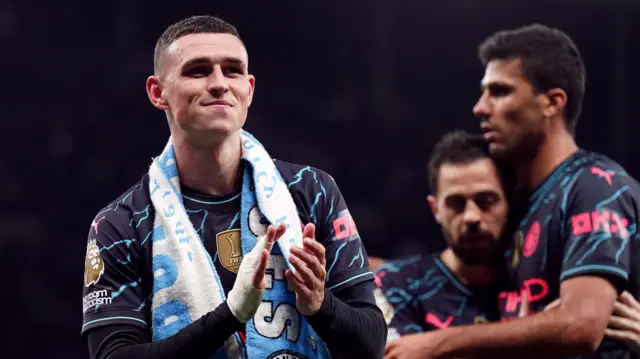 Phil Foden applauds the Manchester City fans at Tottenham