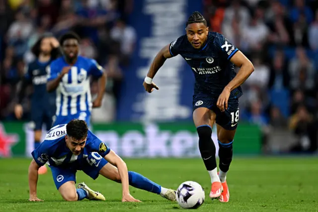 Christopher Nkunku of Chelsea breaks away from Facundo Buonanotte