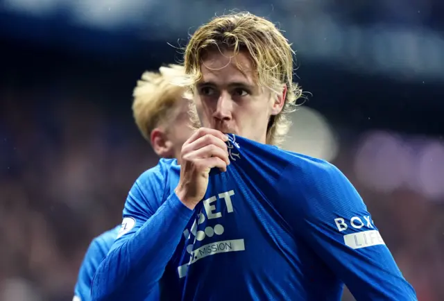 Todd Cantwell kisses the Rangers badge after scoring against Dundee