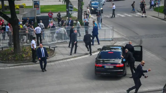 Security officers move Slovak PM Robert Fico in a car after a shooting incident, after a Slovak government meeting in Handlova, Slovakia, May 15, 2024