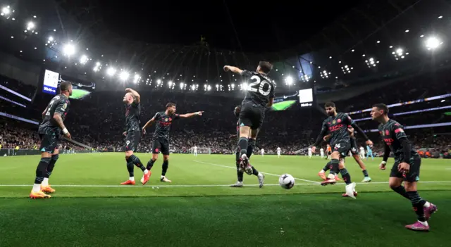 Manchester City players celebrate against Tottenham