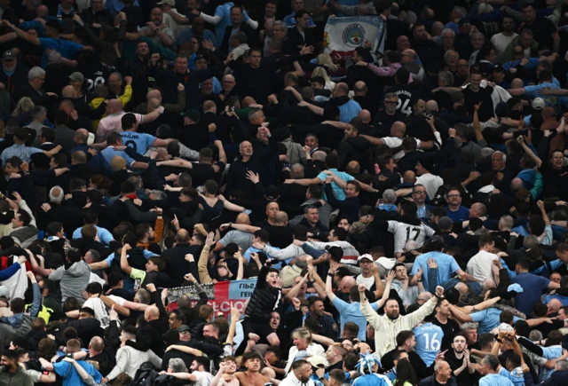 Manchester City fans celebrate against Tottenham