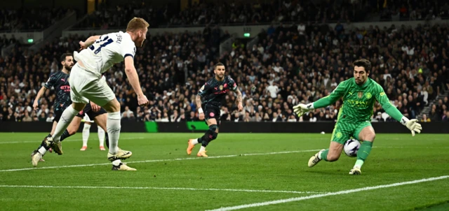 Manchester City's Stefan Ortega saves from Tottenham's Dejan Kulusevski