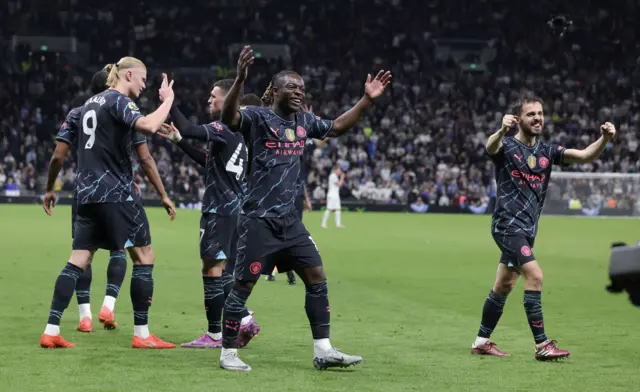 Manchester City players celebrate against Tottenham