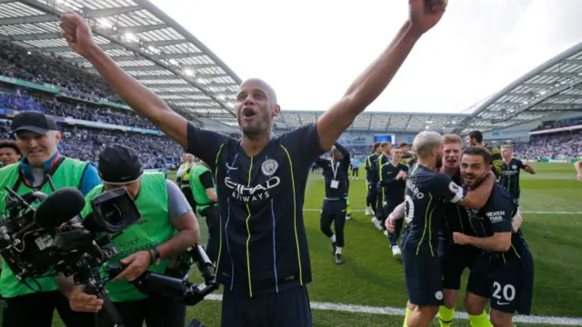 Manchester City celebrate winning the Premier League at Brighton in 2019