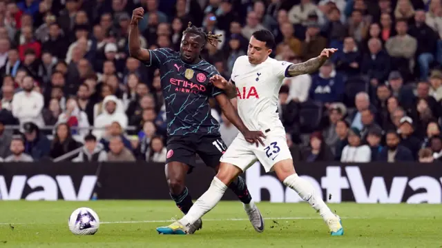 Tottenham's Pedro Porro concedes a penalty for a foul on Manchester City's Jeremy Doku