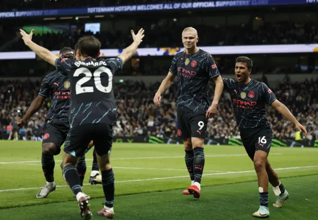 Manchester City players celebrate at Tottenham