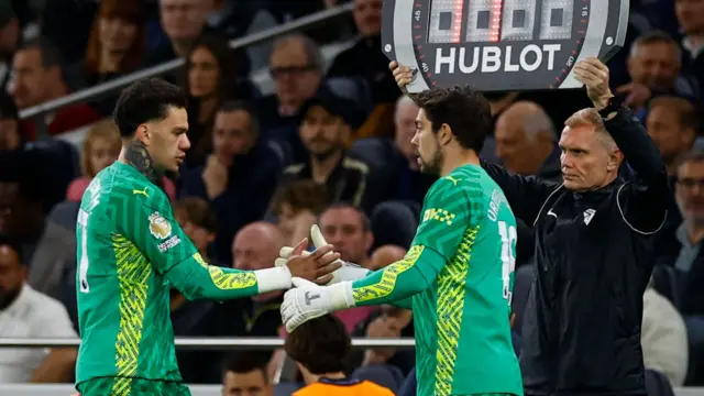 Manchester City goalkeeper Ederson is replaced by substitute Stefan Oretga