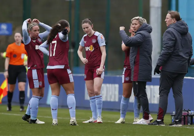 Aston Villa manager Carla Ward speaks to her players