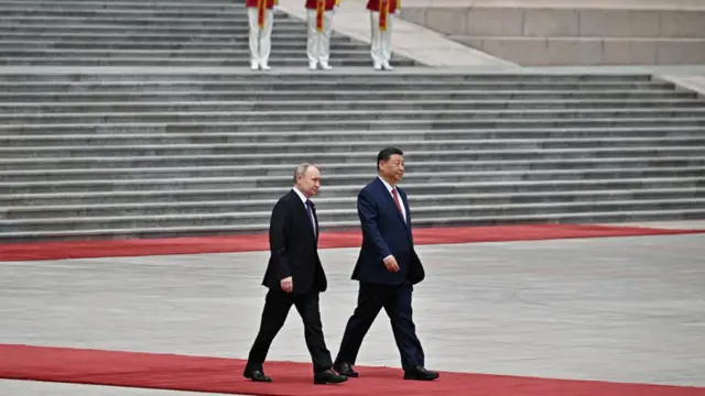 Russian President Vladimir Putin and Chinese President Xi Jinping attend an official welcoming ceremony in Beijing, China