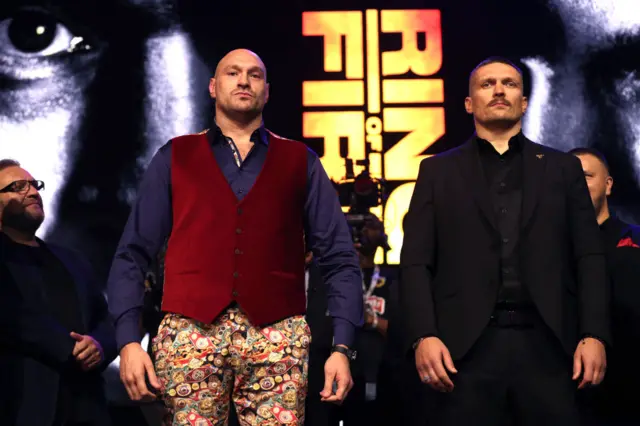 Tyson Fury and Oleksandr Usyk stand side-by-side