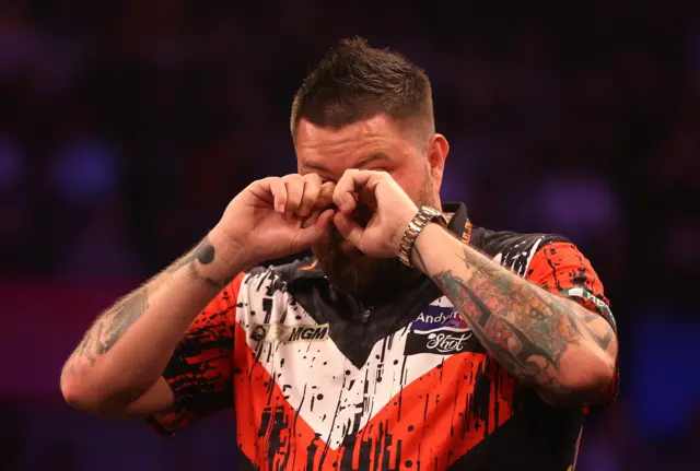 Michael Smith wipes away tears after securing his Premier League Darts play-off spot