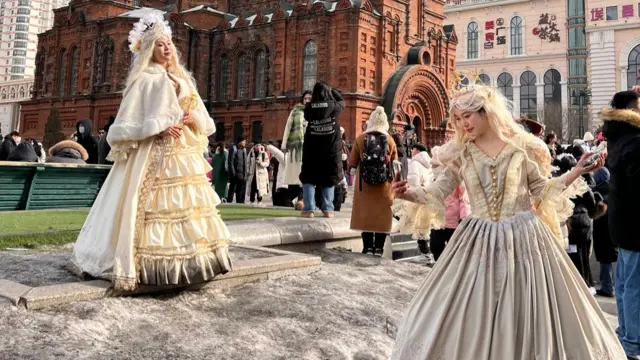 Dancers pose outside the St Sophie Cathedral in Harbin.