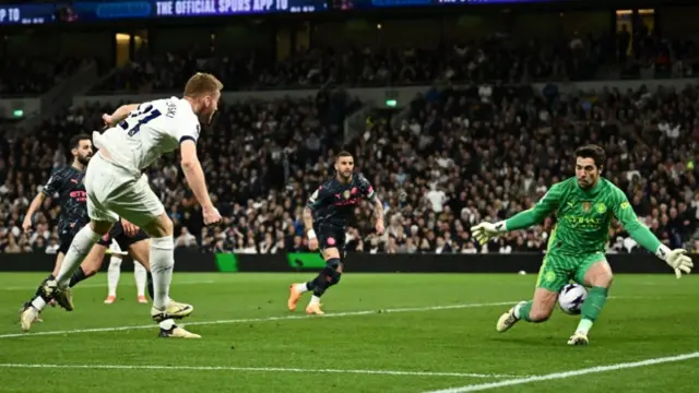 Manchester City's Stefan Ortega saves from Tottenham's Dejan Kulusevski