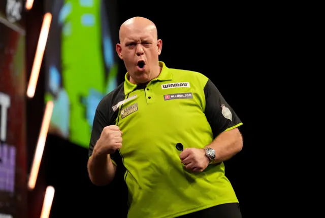 Michael van Gerwen celebrates beating Rob Cross