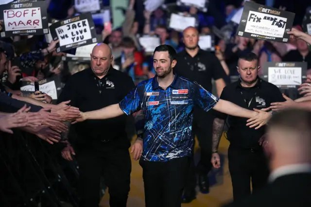 Luke Humphries walks on stage at Night 16 of Premier League Darts in Sheffield