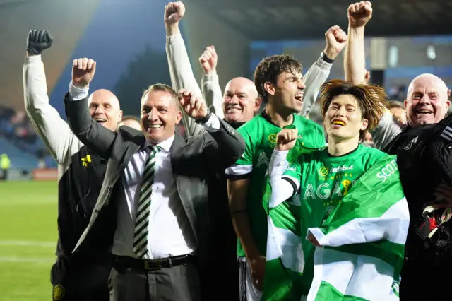 Manager Brendan Rodgers and Kyogo Furuhashi celebrate after Celtic clinch the Scottish title