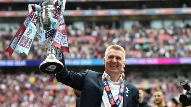 Dean Smith with the play-off trophy