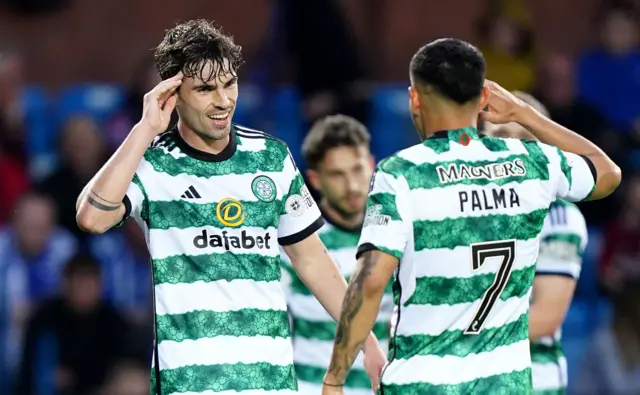 Celtic's Matt O'Riley celebrates a goal with Adam Idah