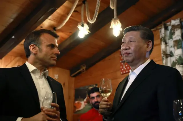 Macron and Xi enjoy a drink in a restaurant at the Tourmalet pass, in the Pyrenees moutains, as part of his two-day state visit to France,