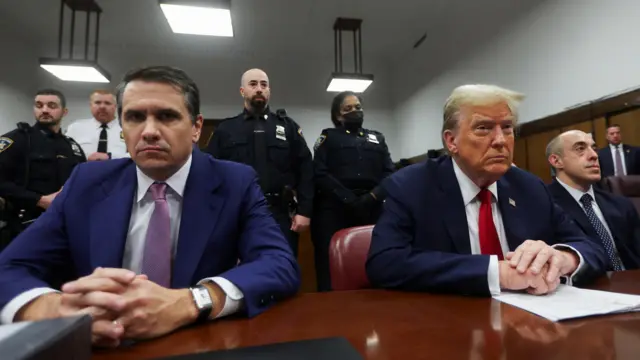 Todd Blanche sits next to his client Donald Trump in court