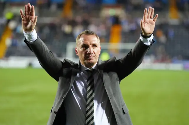 Manager Brendan Rodgers salutes the Celtic fans after clinching the Scottish Premiership title in 2024