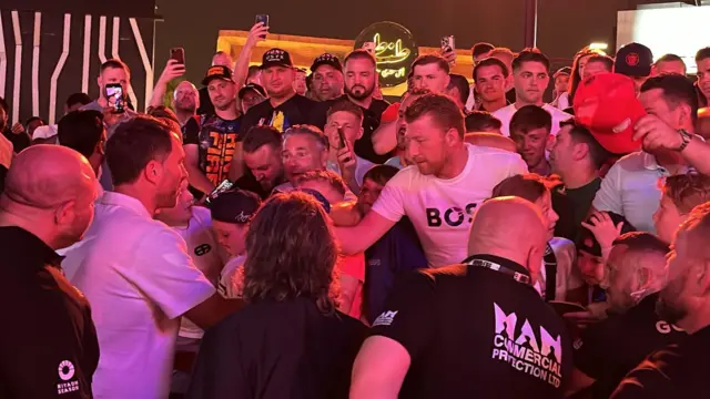 Eddie Hearn signs autographs for boxing fans