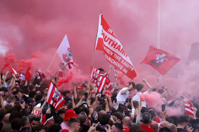 Fans gather outside St Mary's stadium