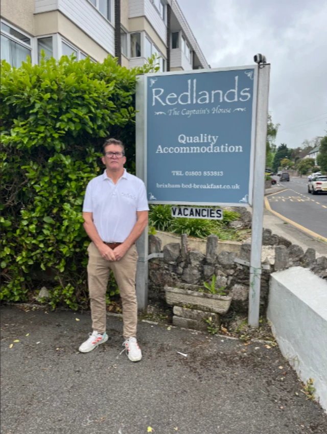 Stephen Cole-Mansfield outside guesthouse in Brixham