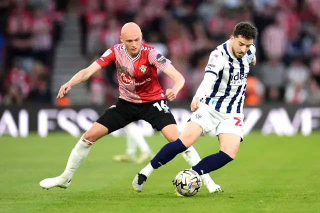 Southampton's Will Smallbone (left) and West Bromwich Albion's Mikey Johnston battle for the ball