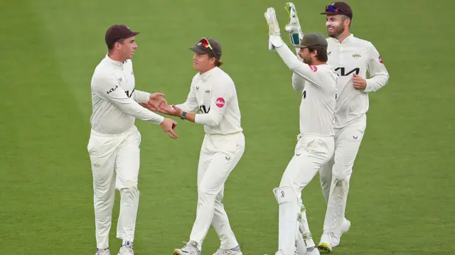 Surrey celebrate taking wicket