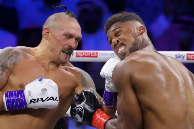 Oleksandr Usyk lands a punch on Anthony Joshua