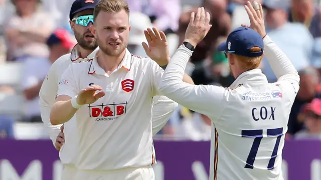 Sam Cook celebrates taking wicket