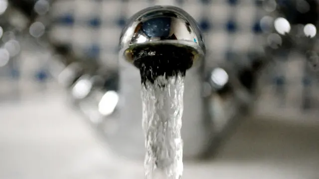 Water coming out of a tap